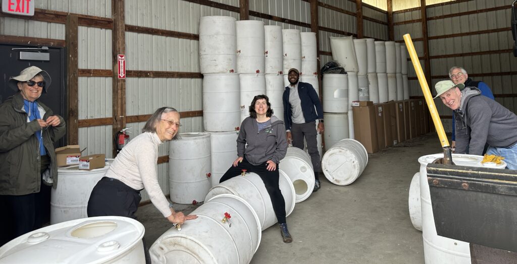 People converting barrels to rain barrels.
